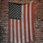 U.S.A. flag hanged on brown brick wall