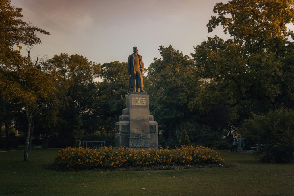 a statue of a man sitting on top of a statue